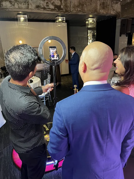 Guest previewing a video beside the 360 photo booth