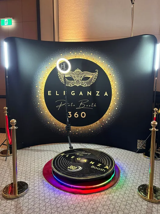 Guest wearing a gold mask on the 360 photo booth platform