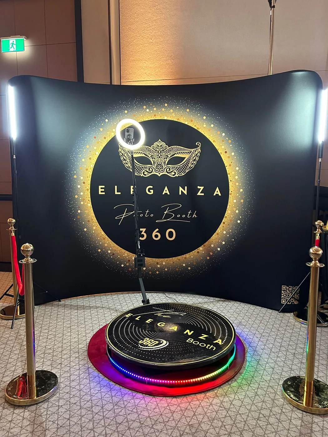 The 360 booth backdrop and platform with gold branding at a Miami event