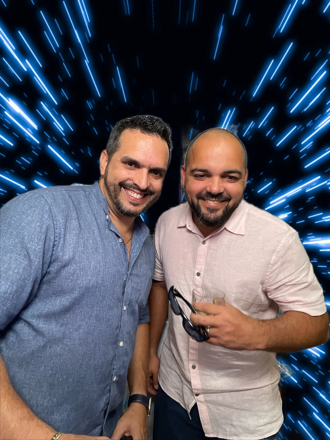 Friends at the photo booth with a digital background at a first birthday party in Miami