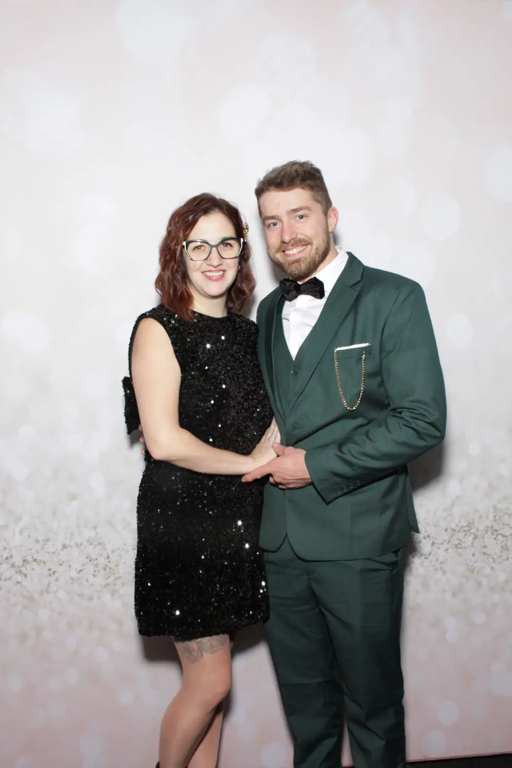 A couple in black tie at the corporate gala photo booth in Miami