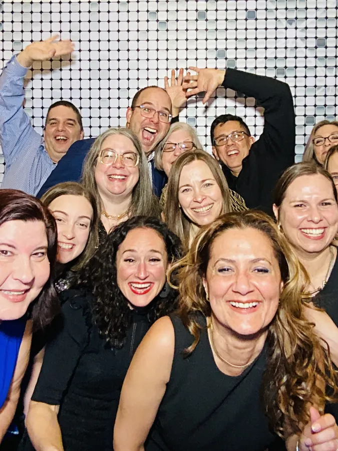 Guests in formalwear at the photo booth during a Brickell corporate evening