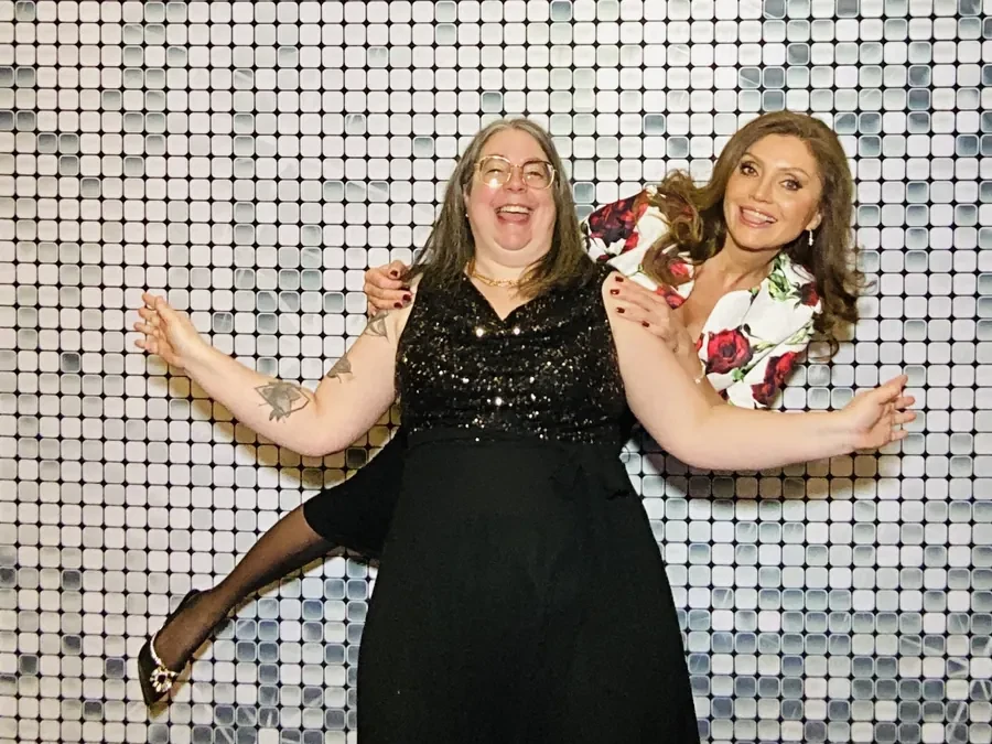 Corporate gala photo booth with a gold backdrop in Miami