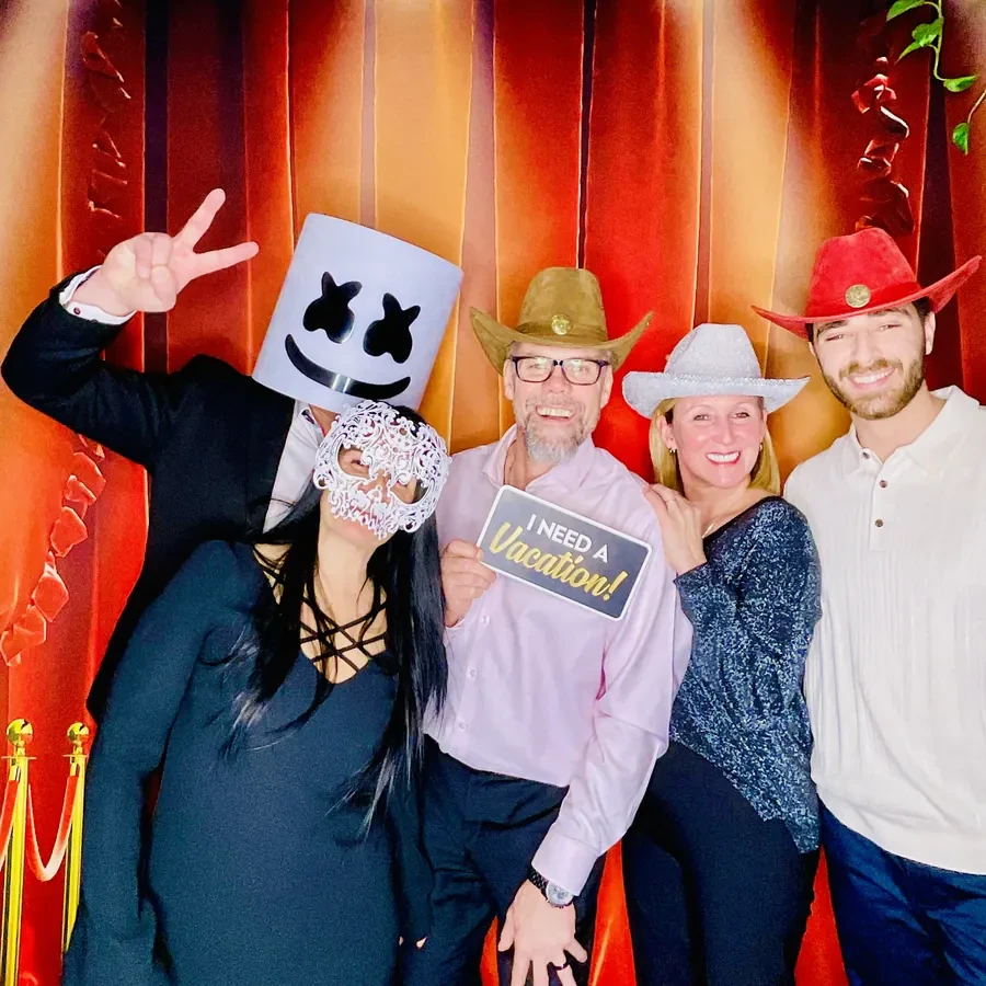 A team group shot at the photo booth during a Miami company party