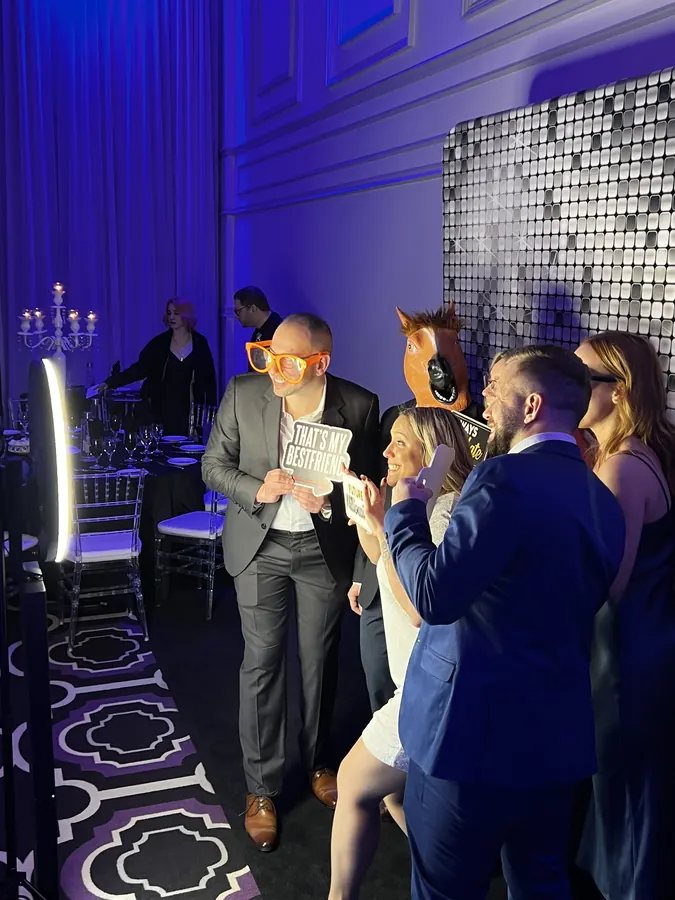 Team at the branded photo booth during a corporate event in Doral