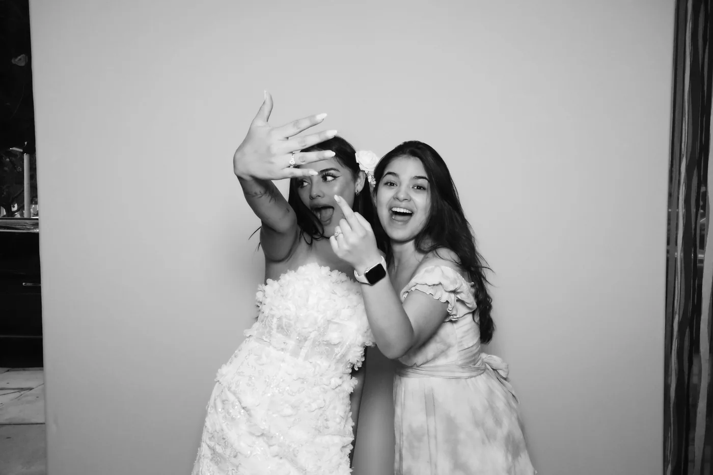 Black and white glam portrait of a bride with a friend at a Miami wedding