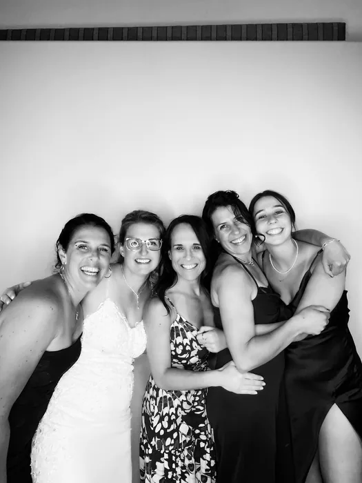 Bride and friends posing in the black-and-white Glam Booth