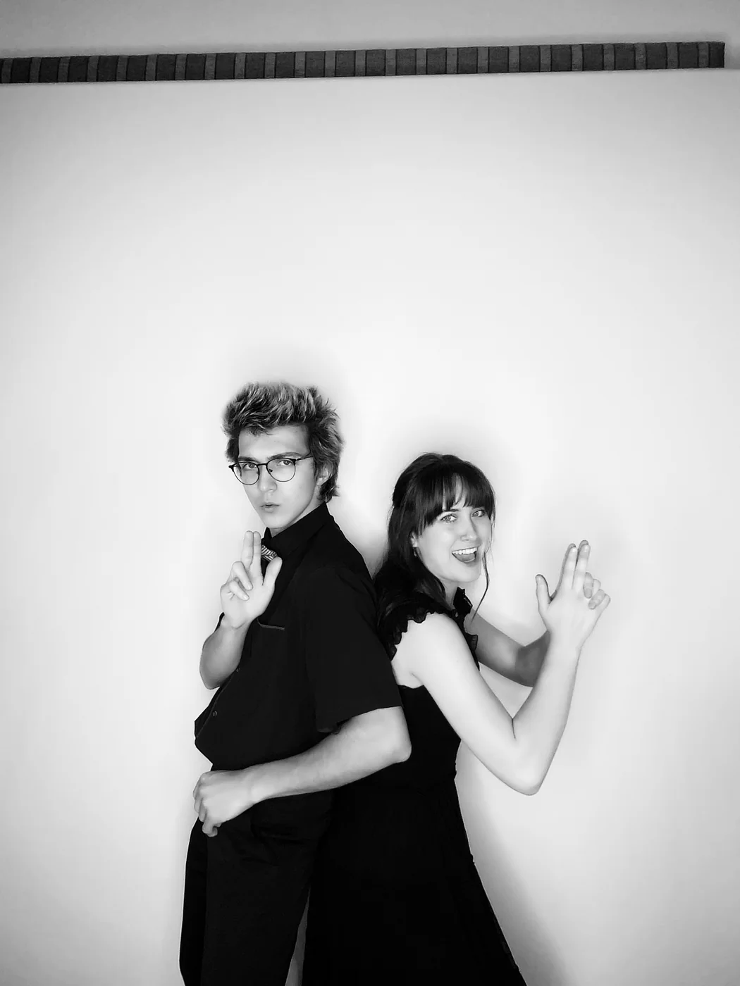 Black and white glam portrait of a couple back to back at a Miami event