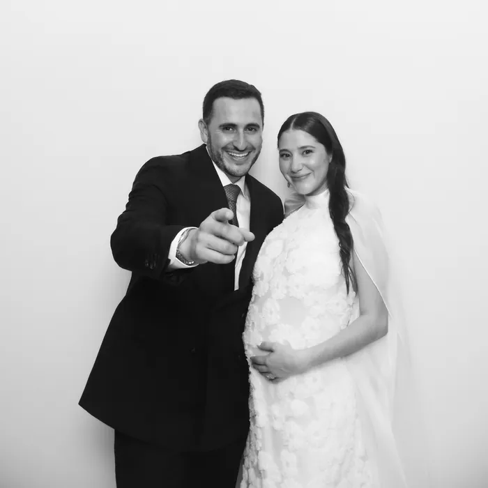Couple posing for a clean black-and-white Glam Booth portrait