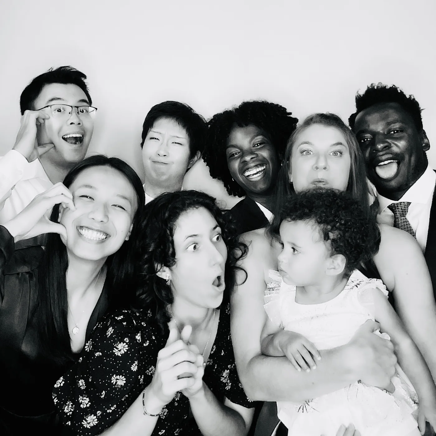 Black and white glam portrait of a family group including a child in Miami