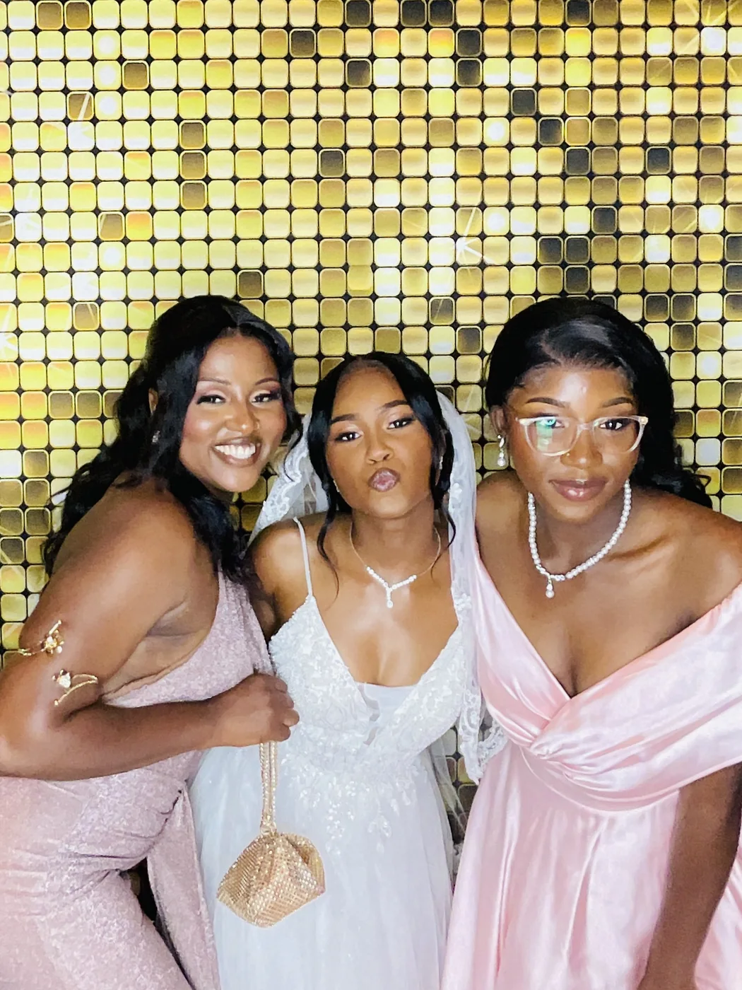 The bride and her bridesmaids at the photo booth in Miami